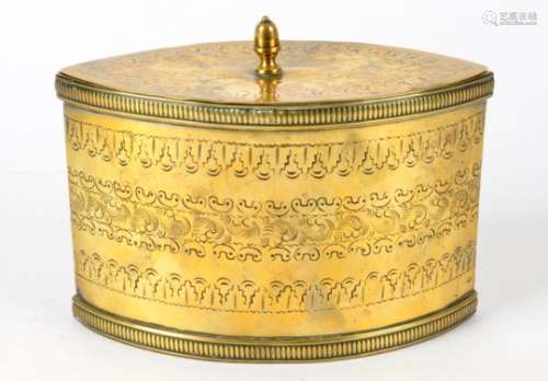 An 1830's brass oval shaped tea caddy, with profusely engraved border decorations, dimensions 18cm x