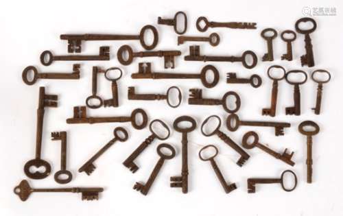 A collection of old keys, approximately 30 in number, of various shapes and sizes (30+)