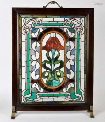 A stained glass fire screen, with central motif of a red rose, height 76cm