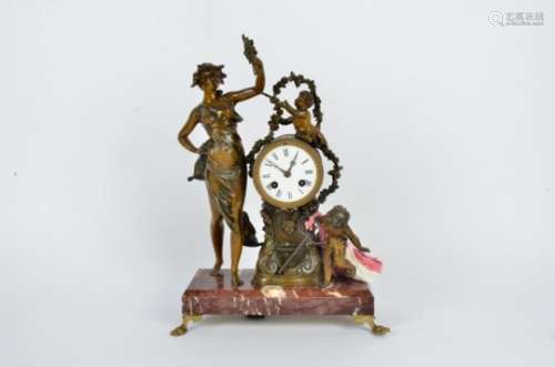 A French Belle Epoque chiming clock, with circular face, raised upon a red marble base with