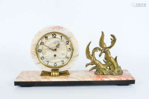 A French Art Deco circular clock, on a coloured marble base, with cast metal decoration of birds