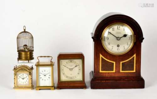 A Mappin & Webb 'Elliot' timepiece, height 16cm, together with a novelty bird cage clock, a Seward