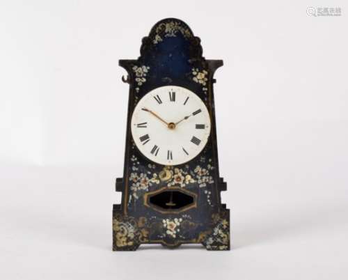 A toleware clock, the metal form enamelled with floral studies, the enamel dial with Roman