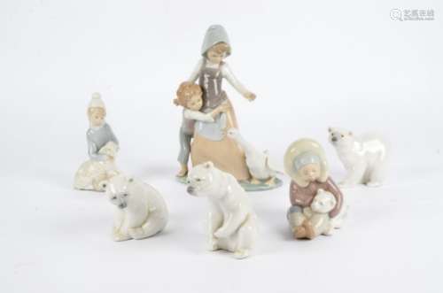A Lladro figure of children and a goose, together with a young girl and lamb, height 25cm, small