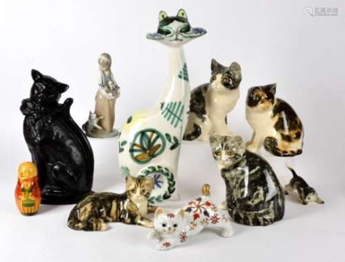 Four Winstanley pottery cats, each with the characteristic glass eyes and signatures to base, height