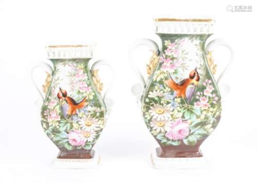 A pair of Continental Victorian vases, both with the same elaborate scrolling twin handled form,