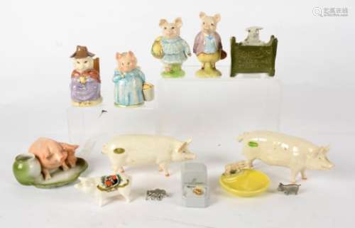 A group of predominantly ceramic pigs, including several characters from the Beatrix Potter