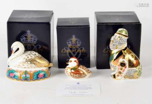Three Royal Crown Derby paperweights, all with gold backstamps and boxed, one a white swan,
