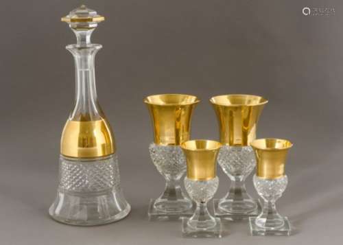 A fine heavy cut glass decanter of mallet form with gilt banded border, hexagonal multi-faceted