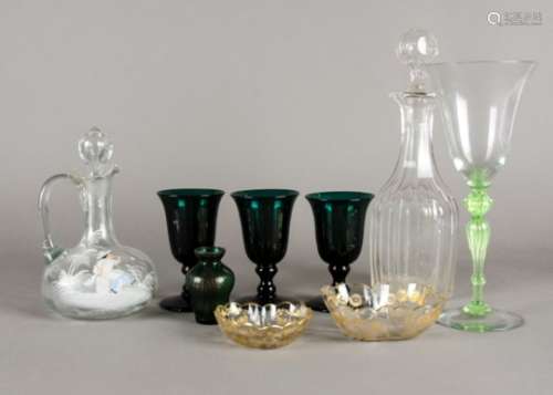 A decanter after the Mary Gregory tradition with young boy blowing a pipe, together with several