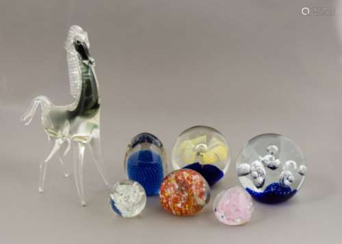 A selection of 20th Century paperweights, of assorted colours and designs, including a set of