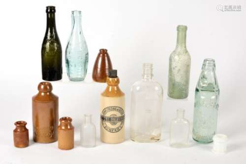 A mixed lot of collectable glass bottles, including a bottle marked 'Eau Precieuse Depensier',