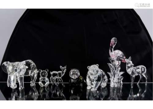 Five Swarovski crystal glass ornaments, including an elephant, two bears (one large and the other