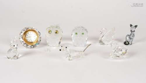 Eight Swarovski crystal glass ornaments, to include two owls, two swans, a clock, a dog, cat and