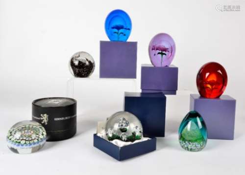 A collection of glass paperweights, including three Crystal Clear examples titled Roma, Vincenza,