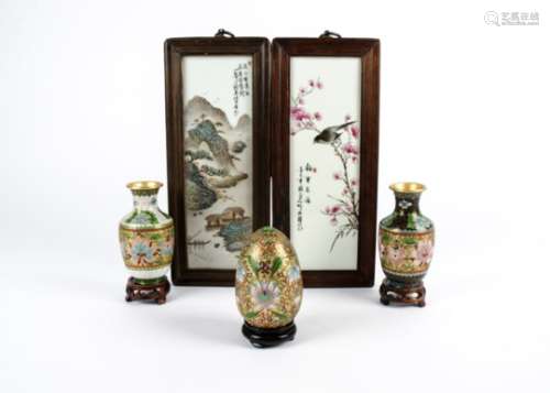 A pair of Chinese Republic Period famille rose plaques, one depicting a bird perched on a branch,