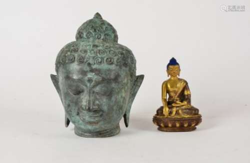 A cast metal Buddhist head, height 19cm, together with a seated Buddhist figure in the lotus