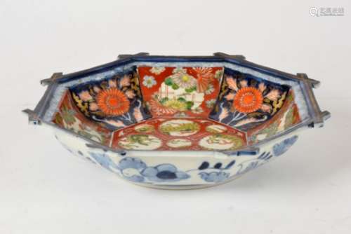A Japanese arita ware octagonal plate, with typical imari palette and interesting central