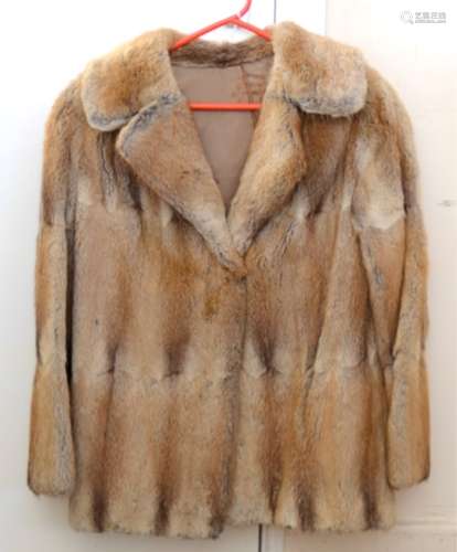 A lady's vintage three quarter length brown fur coat, with a brown satin lining, the monogram 'G M