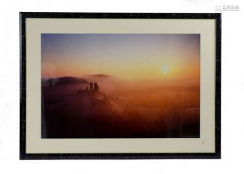 An original photographic print 'celestial skies', showing Corfe Castle in Dorset at dusk or dawn,