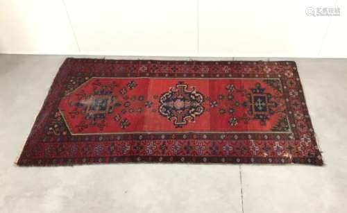 An early 20th Century Caucasian woollen carpet, similar to a Mihrab, 236cm x 123cm, AF