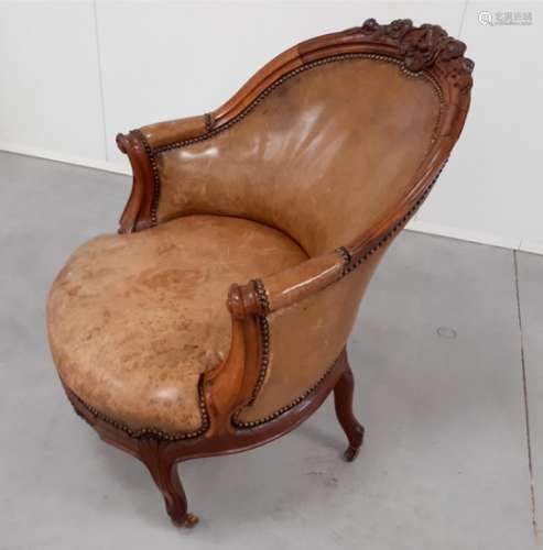 A 19th Century carved walnut tub chair, scroll arms, raised on French cabriole front supports