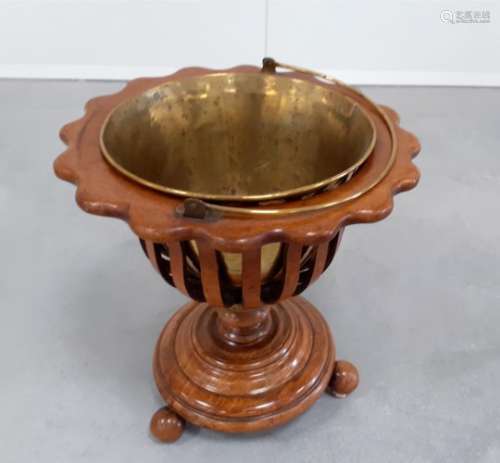 A 19th Century Dutch walnut Jardinere, shaped top with slatted sides, turned column on circular base