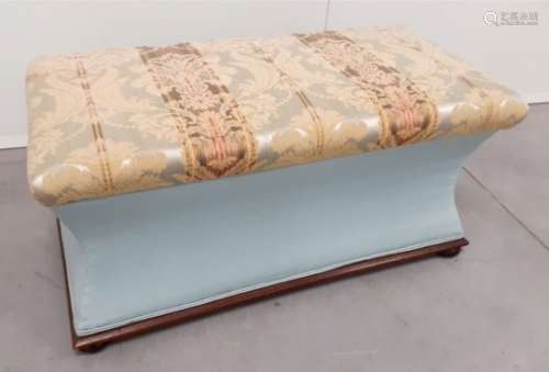 An upholstered 19th Century sarcophagus Ottoman, with a mahogany moulded edge to base, raised on bun