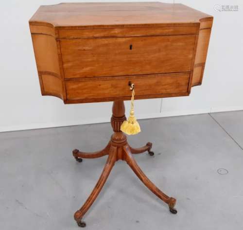 A 19th Century satinwood work table, shaped sides, rising top revealing silk fitted interior above