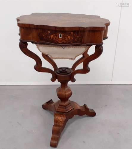 A 19th Century Dutch walnut work table, tripod base with stem and arms supporting shaped upper