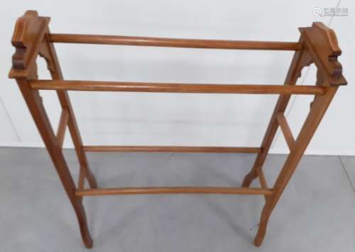 A late 19th Century mahogany towel rail, shaped side supports with box wood stringing, 70cm x 23cm x