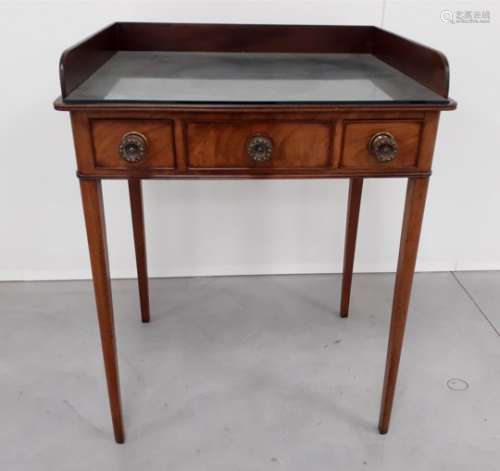 A Georgian mahogany wash stand, gallery back, one central false drawer flanked by two short drawers,