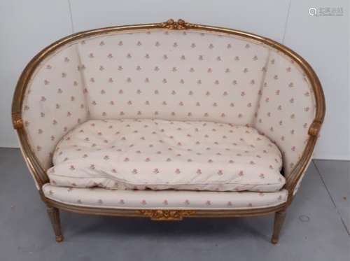 A 19th Century French Louise XVI settee, with carved gilded frame, loose cushion and tulip pattern