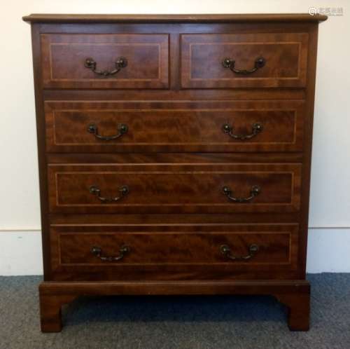 A contemporary mahogany inlaid chest of drawers, two short over the long drawers, raised on