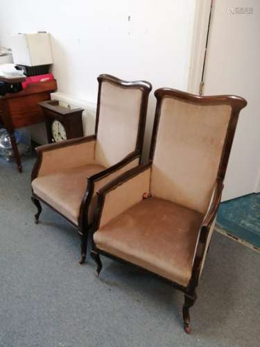 A pair of antique high backed library chairs on castors, mahogany framed, (2) one foot has become