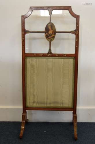 An Edwardian period Sheraton revival satinwood painted fire screen, floral decoration, four glass