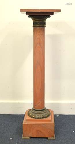 A late 19th Century marble stand, square pink base on backet feet, having column stem with gilt