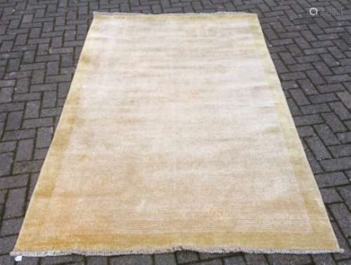 Two 20th Century rugs, one with a large beige central section with a yellow border and pinstripes