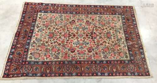 A 20th Century Middle Eastern woollen carpet, 290cm x 197cm