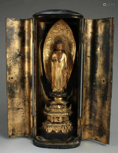 A Carved Wooden Standing Buddha Statue in a Box