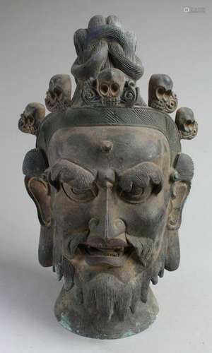 A Chinese Bronze Deity Head Statue