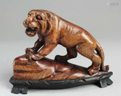 A Carved Stone Beast Figurine With Stand