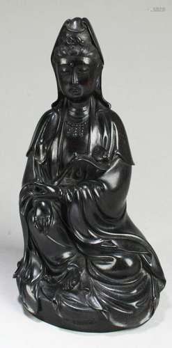 A Carved Zitan Guanyin Statue