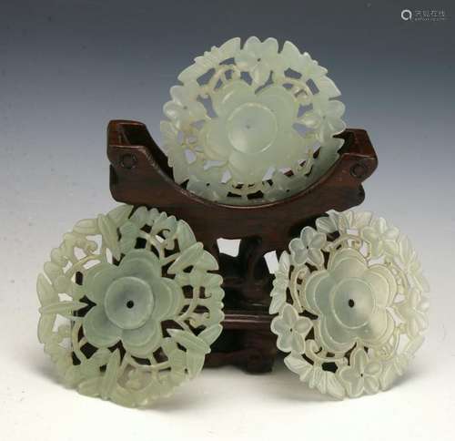 THREE PIERCED JADE BUTTONS