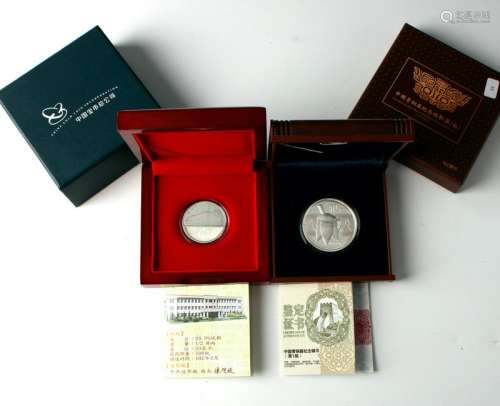 2 COMMEMORATIVE CHINESE COINS