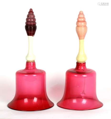 Two large Victorian cranberry glass bells, 31cms (12.25ins) high (2).