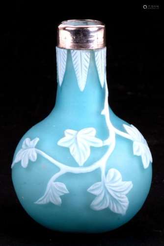 A miniature cameo glass vase by Thomas Webb & Sons; satin blue glass overlaid in opaque white, cut