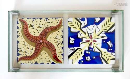 Two decorative ceramic tiles after Dali (1954) mounted in a glass display case