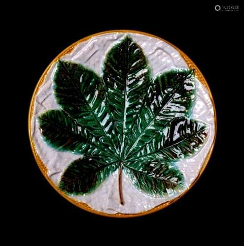 A 19th century George Jones majolica dish decorated with a horse chestnut leaf, 22cms (8.75ins)