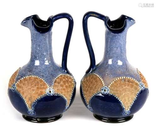 A pair of Royal Doulton stoneware jugs, 19cms (7.5ins) high (2).